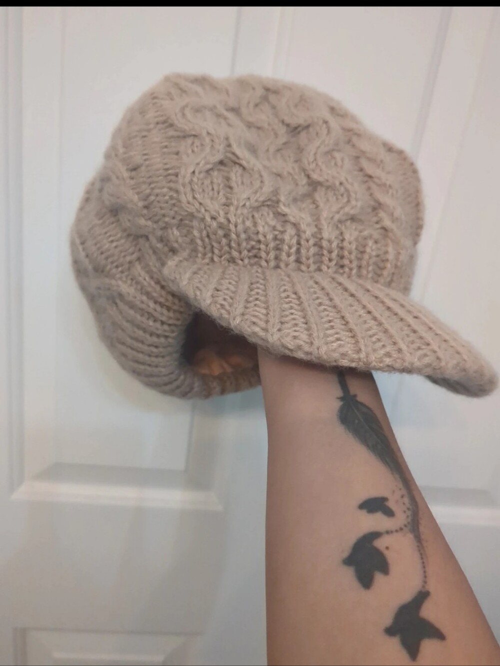 Beautiful beige/taupe knitted newsboy cap with a cozy cable-knit design